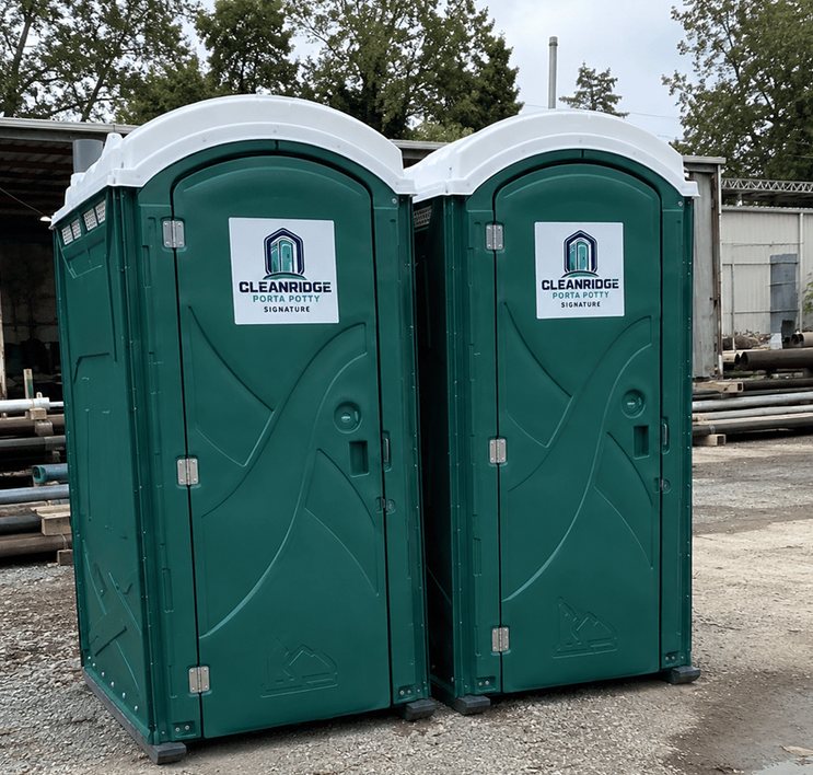 Two Cleanridge portable toilets delivered side by side to a supply yard